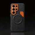Black textured phone case with orange camera frame and magnetic charging circle.