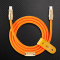 Orange USB-C to USB-C charging cable with gold connectors and leather strap